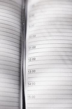 2015 leather personal black note book organizer on wooden background.