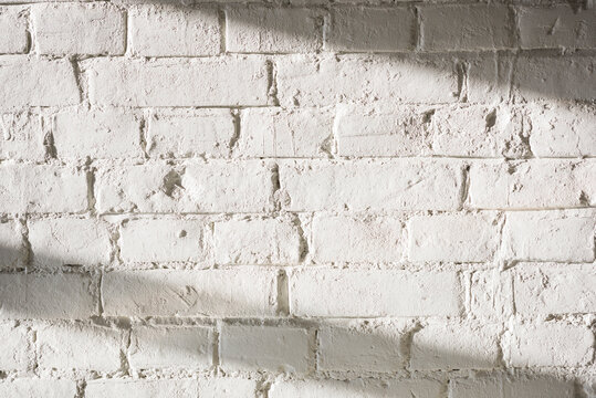 Fototapeta White brick wall indoors