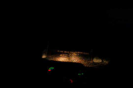 a spooky gate in the nighttime