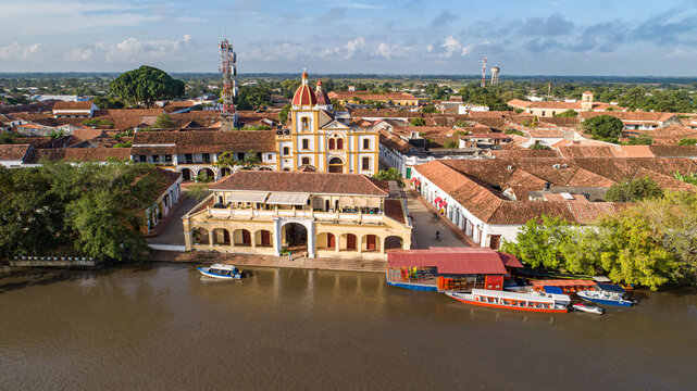 Aerial view of historic church and park Immaculada  Concepcion  (Immaculate Conception) in Santa Cruz de Mompox in sunlight with river, World Heritage