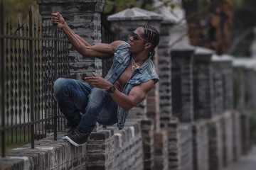 black boy hanging on the fence