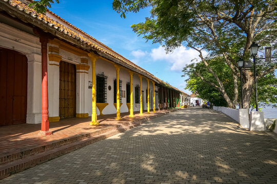 Typical historic houses with colored columns in front, river promenade Santa Cruz de Mompox, Colombia, World Heritage