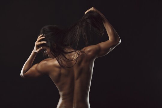 Topless female with muscular body