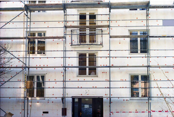 White building with red dots