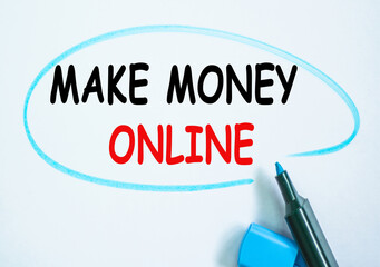 Check list and marker. Definition of the word MAKE MONEY ONLINE highlighted with a marker. partial focus