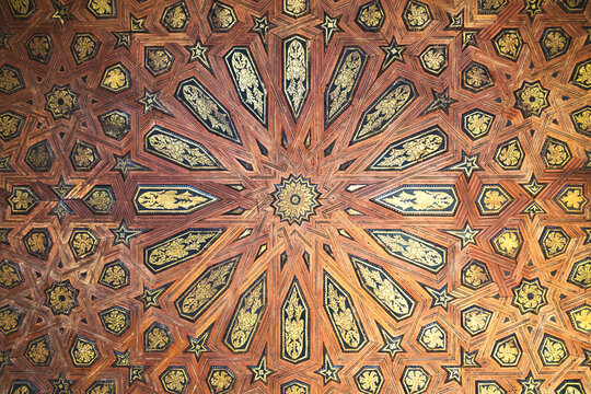 Arab details of a wooden roof in a palace of Alhambra