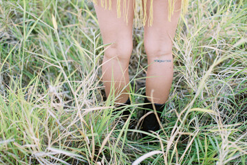 tattoo on pretty girl's legs of hawaii coordinates