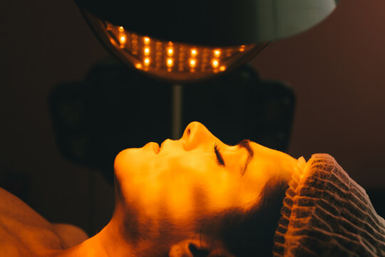 Woman in a Beauty Clinic Receiving a Facial Color Light Treatment