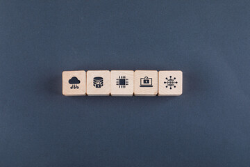 Conceptual of cloud server and business. with wooden blocks with icons on dark color background...