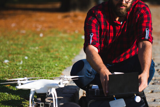 Man setting up a drone
