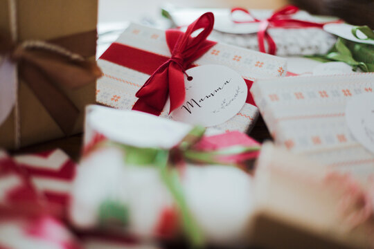 Pile of wraped gift with name tags on it