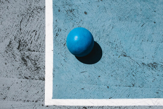 Blue ball in an urban playing field