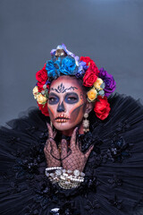 Closeup portrait of female model with a sugar skull makeup