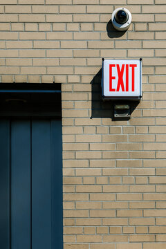 Exit Sign on a Brick Wall