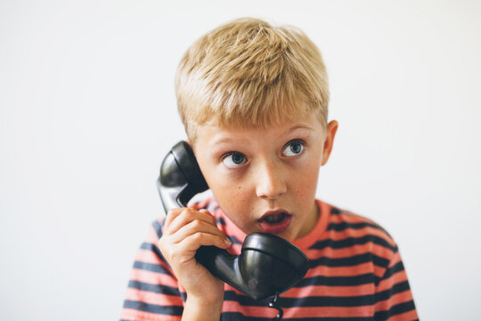 boy having a telephone conversation