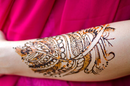 A woman with henna adorned arms and hands !