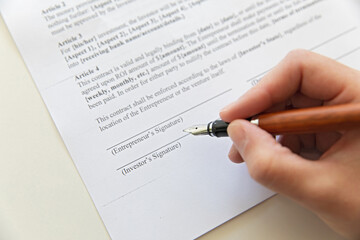 Closeup of contract and pen.