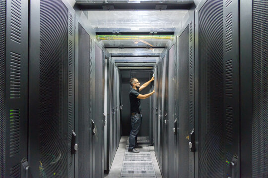 IT computer expert working on Network server