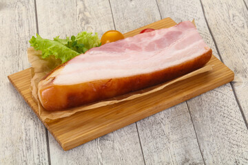 Smoked pork breast with salad leaves