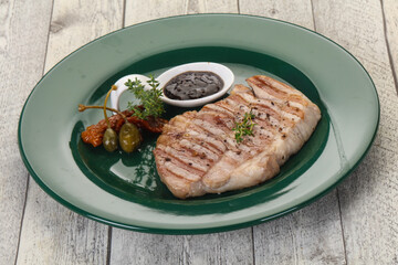 Grilled pork steak with pepper sauce
