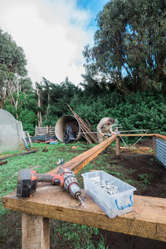 Handyman building raised garden beds