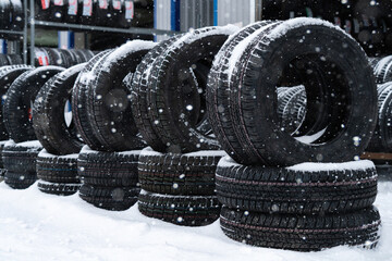 Tire and wheels shop on the street. Seasonal tire change.	