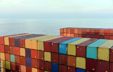 View on the stacks of the containers loaded on deck of the cargo ship.