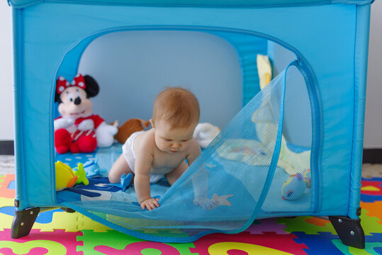 Baby Girl Escaping From Playpen, Crawling Out