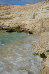 Fototapeta na wymiar Silky blue sea waves and beautiful rocky coast. Crimea, black sea. 