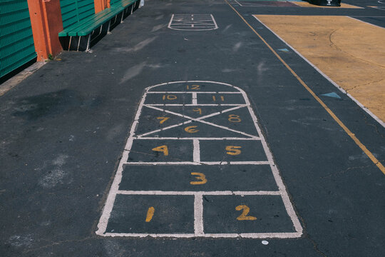 learn numbers and hop-scotch painted on concrete on playground
