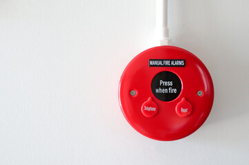 Alarm light on white wall warning symbol Fire incident