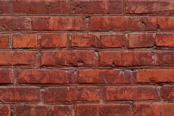 Old red brick wall texture background close up