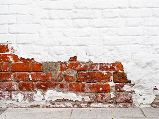 shabby red and white painted brick wall on Varvarka street in Moscow city