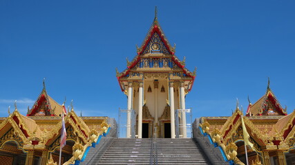 Gorgeous buddhist temple soars into blue sky