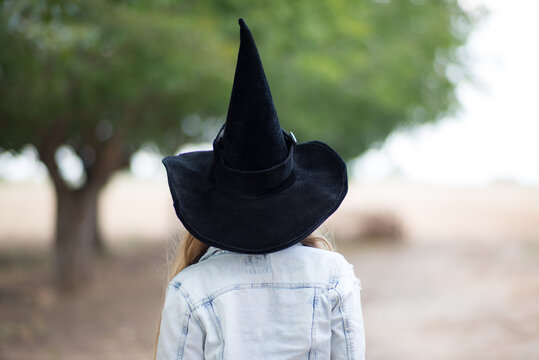 blonde girl in a witch costume