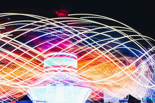 Colourful Ligths Of A Ride In A Fair At Night