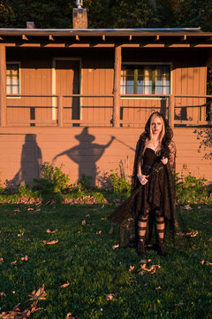 Beautiful woman in witch costume celebrating Halloween