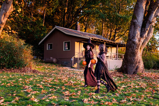Beautiful women in witch costume celebrating Halloween