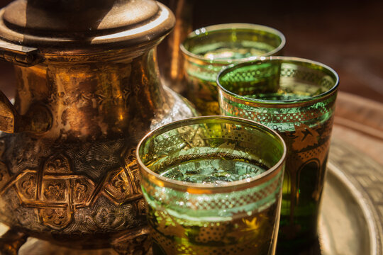 Green tea with mint served in artisanal glasses and teapot from Maghreb