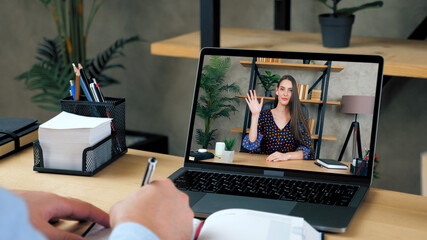 Smart woman tutor in laptop screen greets talk speak teaches by remote web cam, distance education. Man student studying at home office online by conference video call computer, writes in notebook