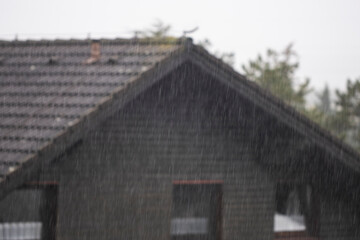 Fototapeta na wymiar rainy day, rain falling viewed from window 