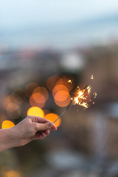 Woman's hand holding a sparkler
