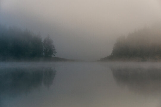 Fog above the lake in the morning
