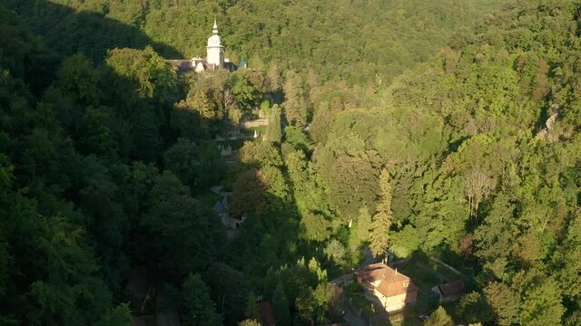 Lillafured, Hungary - 4K flying towards the famous Lillafured Castle in the mountains of Bukk near Miskolc on a sunny summer morning