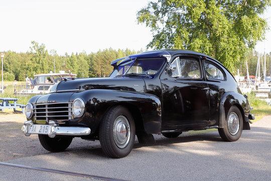 Spiken, Sweden - June 23, 2020: Side view of a stationary black Volvo PV 444-E from 1953.
