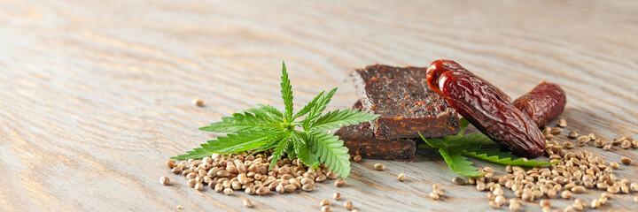 Chocolate protein bar with hemp seeds and dates. Healthy vegan food. Banner