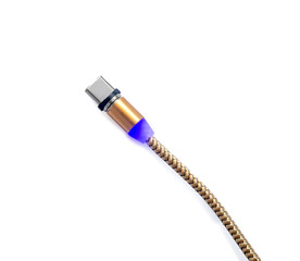 Gold color magnetic charger wire for phone on white background