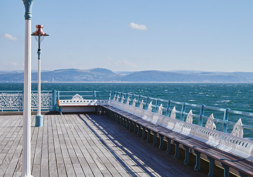 Lamp and seating on Mumbles Pier. Wales, UK.
