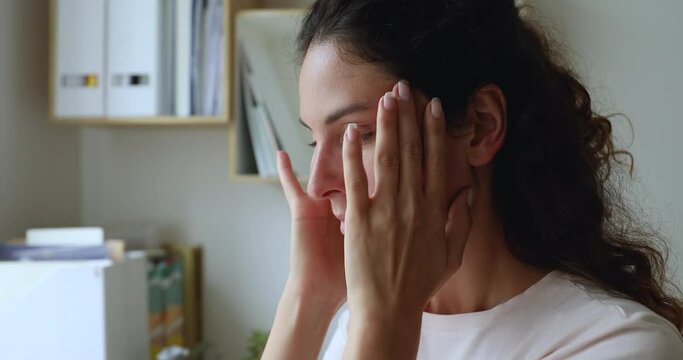 Close up stressed woman make breath practice exercises, reducing getting rid of negative emotions, make her mental state at peace free from anxiety and angry, search inner harmony and balance concept
