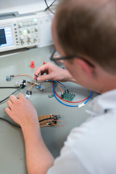 Young technican working in lab